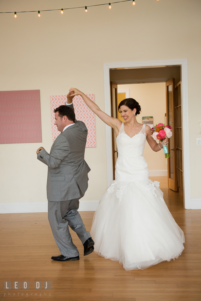 The Bride and Groom enter the reception venue while dancing along to the introductory song from James Brown, I Got You, I Feel Good. Chesapeake Bay Environmental Center, Eastern Shore Maryland, wedding reception and ceremony photo, by wedding photographers of Leo Dj Photography. http://leodjphoto.com