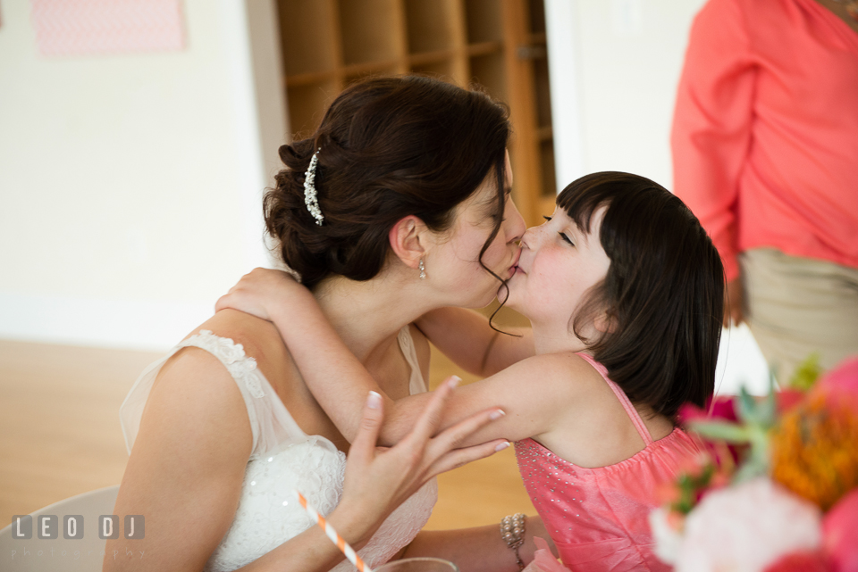 The Bride kissing one of the flower girls. Chesapeake Bay Environmental Center, Eastern Shore Maryland, wedding reception and ceremony photo, by wedding photographers of Leo Dj Photography. http://leodjphoto.com