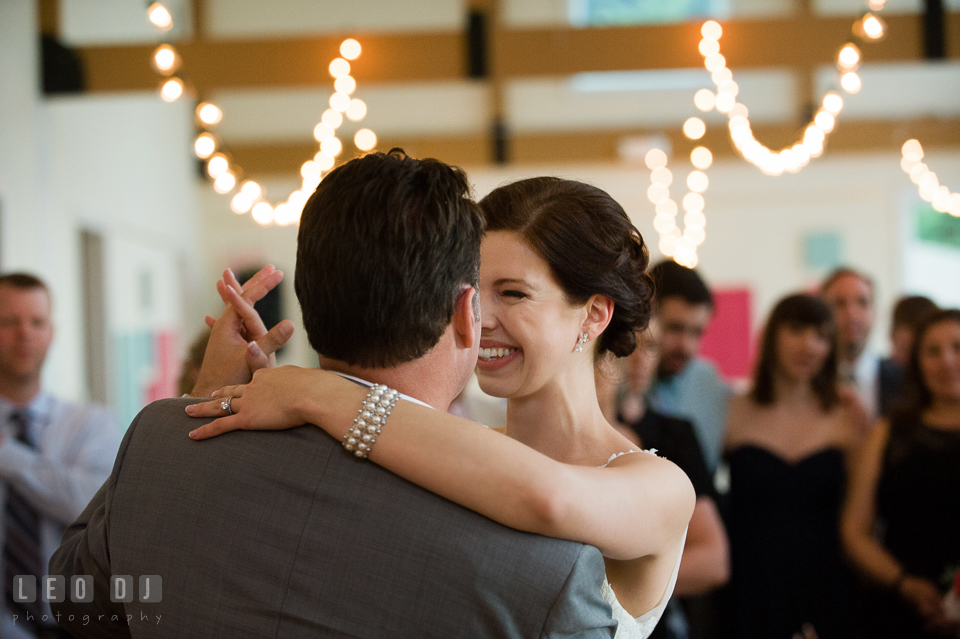 Bride and Groom smiling during their first dance. Chesapeake Bay Environmental Center, Eastern Shore Maryland, wedding reception and ceremony photo, by wedding photographers of Leo Dj Photography. http://leodjphoto.com