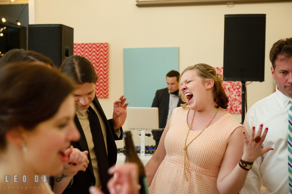 Guests dancing and singing to the song playing. Chesapeake Bay Environmental Center, Eastern Shore Maryland, wedding reception and ceremony photo, by wedding photographers of Leo Dj Photography. http://leodjphoto.com