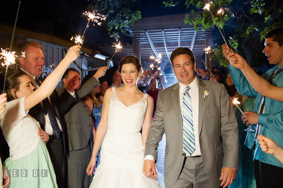 Bride and Groom had a grand exit by going through a row of guests holding sparklers. Chesapeake Bay Environmental Center, Eastern Shore Maryland, wedding reception and ceremony photo, by wedding photographers of Leo Dj Photography. http://leodjphoto.com