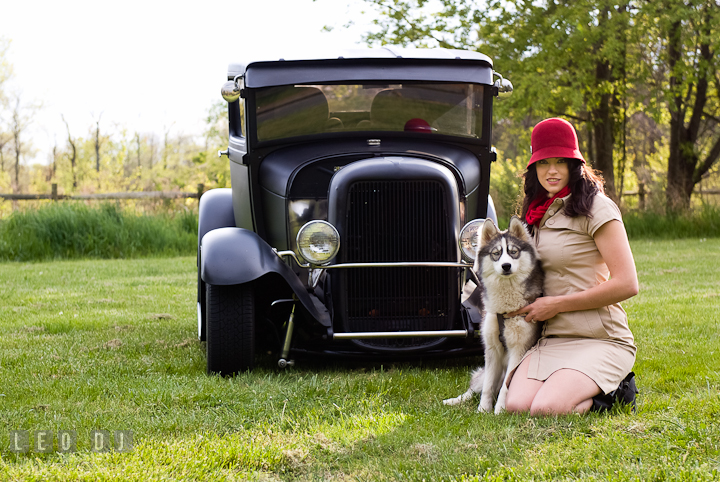 Girl and her dog posing by an antique Ford model car. Model portrait session with Brittany from Beyond the Veil music Band and her Siberian Husky pet dog at Kent Island, Maryland Eastern Shore by photographer Leo Dj Photography.