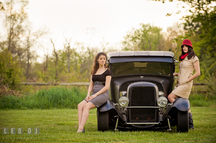 High school senior girl and her sister posing by a vintage Ford model car. Model portrait session with Brittany from Beyond the Veil music Band and her Siberian Husky pet dog at Kent Island, Maryland Eastern Shore by photographer Leo Dj Photography.