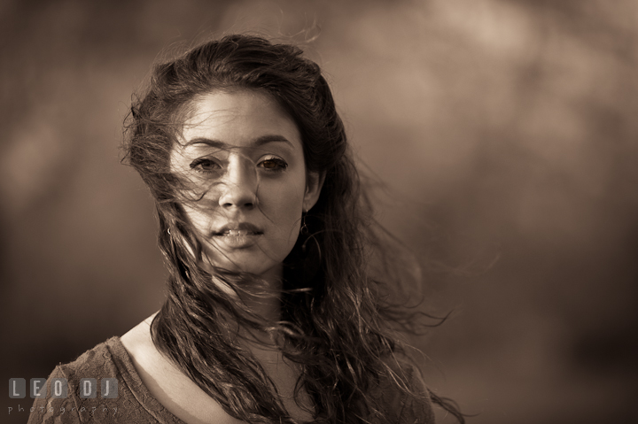 Portrait of girl with her hair blown by the wind. Eastern Shore, Maryland, Kent Island High School senior portrait session by photographer Leo Dj Photography.