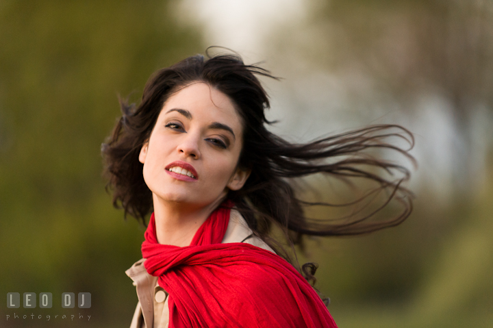 Girl with red scarf have her hair blown by the wind. Model portrait session with Brittany from Beyond the Veil music Band and her Siberian Husky pet dog at Kent Island, Maryland Eastern Shore by photographer Leo Dj Photography.