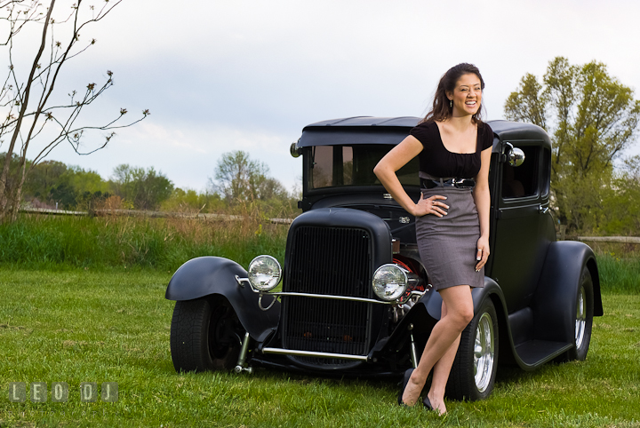 Girl laughing in front of an old Ford car. Eastern Shore, Maryland, Kent Island High School senior portrait session by photographer Leo Dj Photography. http://leodjphoto.com