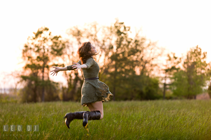 Girl jumping high up in the air in a grass meadow. Eastern Shore, Maryland, Kent Island High School senior portrait session by photographer Leo Dj Photography. http://leodjphoto.com