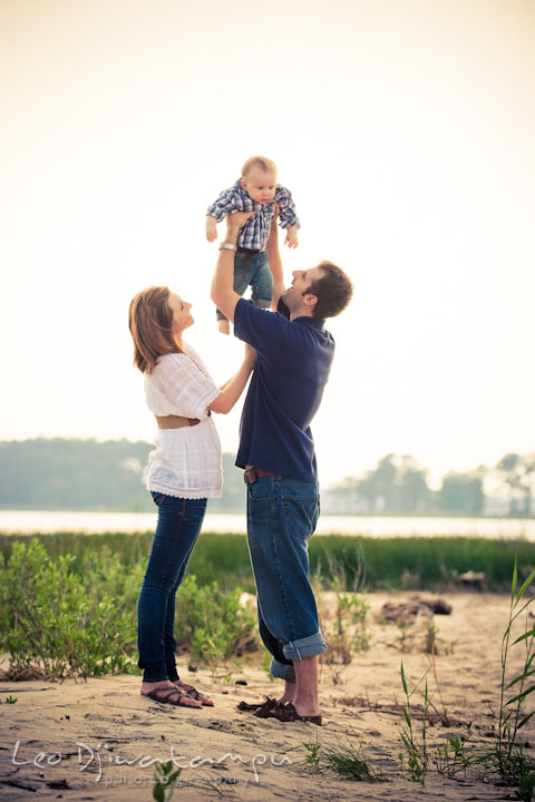 Father holding up baby boy high up in the air. Eastern Shore Maryland Kent Island Family Lifestyle Portrait Photo Session by Photographer Leo Dj Photography