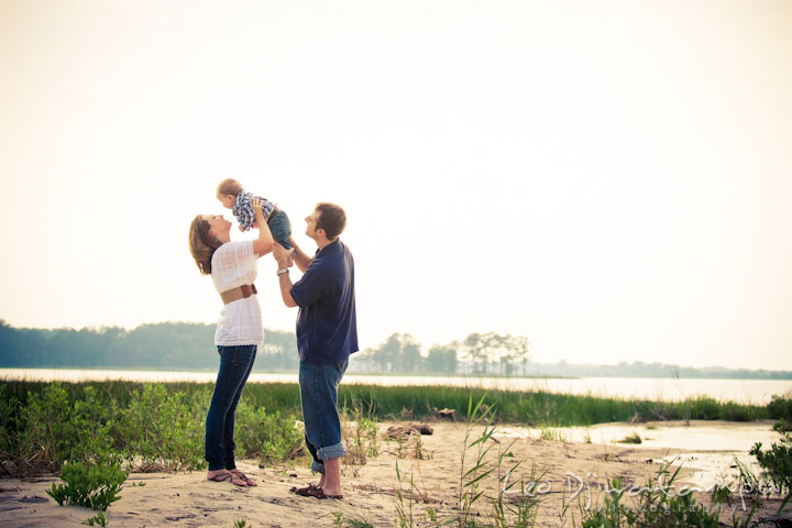 Family on the beach. Mother holding baby up in the air. Eastern Shore Maryland Kent Island Family Lifestyle Portrait Photo Session by Photographer Leo Dj Photography