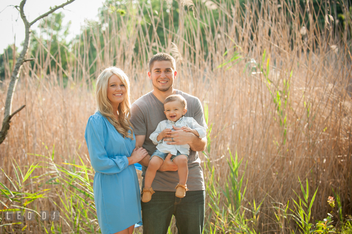 Father, Mother, and Son posing for the camera. Kent Island, Annapolis, Eastern Shore Maryland candid children and family lifestyle portrait photo session by photographers of Leo Dj Photography. http://leodjphoto.com