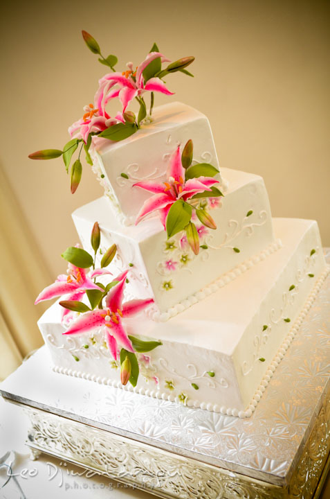 Beautiful wedding cake with red lilly. Ceresville Mansion Frederick Maryland Wedding Photo by wedding photographer Leo Dj Photography