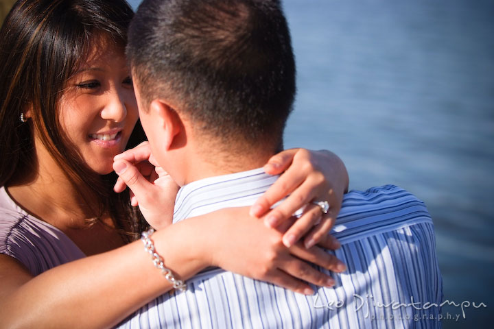 Engaged couple holding each other. National Harbor, Gaylord National Hotel pre-wedding engagement photo session