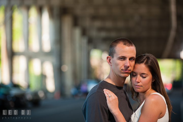Engaged girl hugging her fiancé under an overpass. Renaissance Costume Cosplay fun theme pre-wedding engagement photo session at Maryland, by wedding photographers of Leo Dj Photography. http://leodjphoto.com