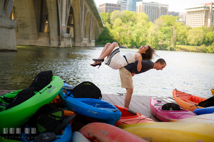 Engaged guy having fun lifting up his fiancée on his back. Georgetown Washington DC pre-wedding engagement photo session, by wedding photographers of Leo Dj Photography. http://leodjphoto.com