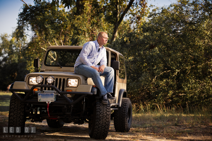 Guy sitting on front of his Jeep. Eastern Shore, Maryland, Kent Island High School senior portrait session by photographer Leo Dj Photography. http://leodjphoto.com