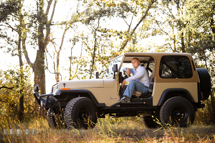 Guy sitting inside his Jeep in a forest. Eastern Shore, Maryland, Kent Island High School senior portrait session by photographer Leo Dj Photography. http://leodjphoto.com