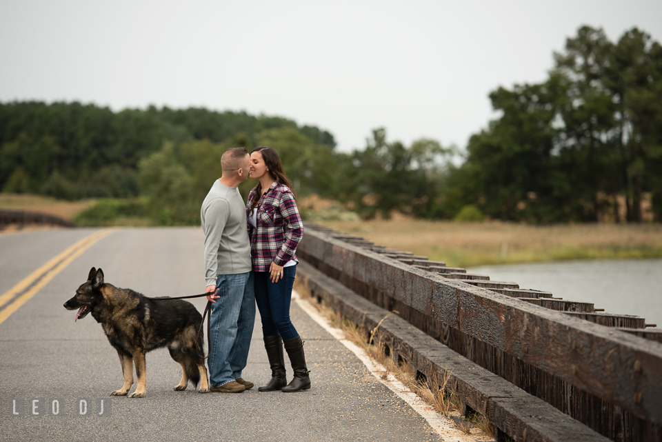 Wye Island Queenstown Maryland engaged girl walking with her fiancé and dog photo by Leo Dj Photography.
