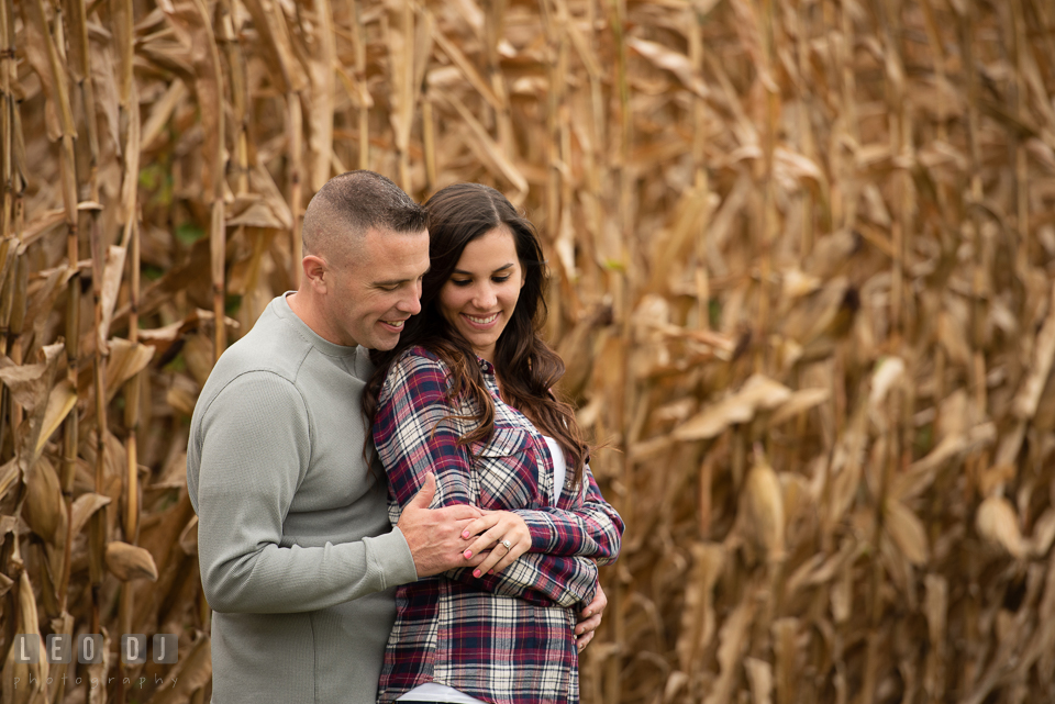 Wye Island Queenstown Maryland engaged man hugged fiancée from behind photo by Leo Dj Photography.