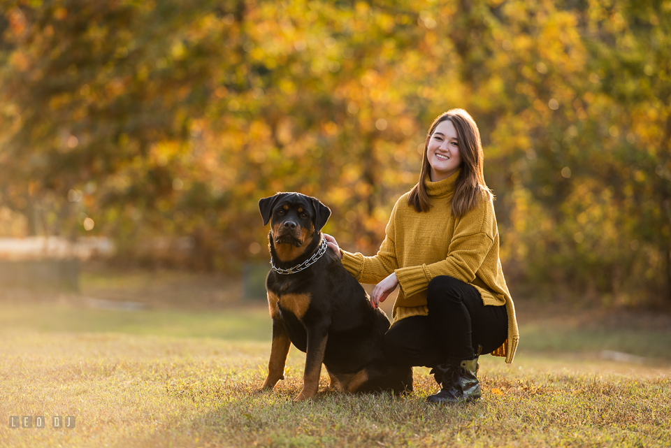 Kent Island High School Maryland senior with her dog in autumn photo by Leo Dj Photography.